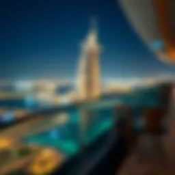 Panoramic view of the Burj Al Arab with the Skyview Lounge illuminated at night